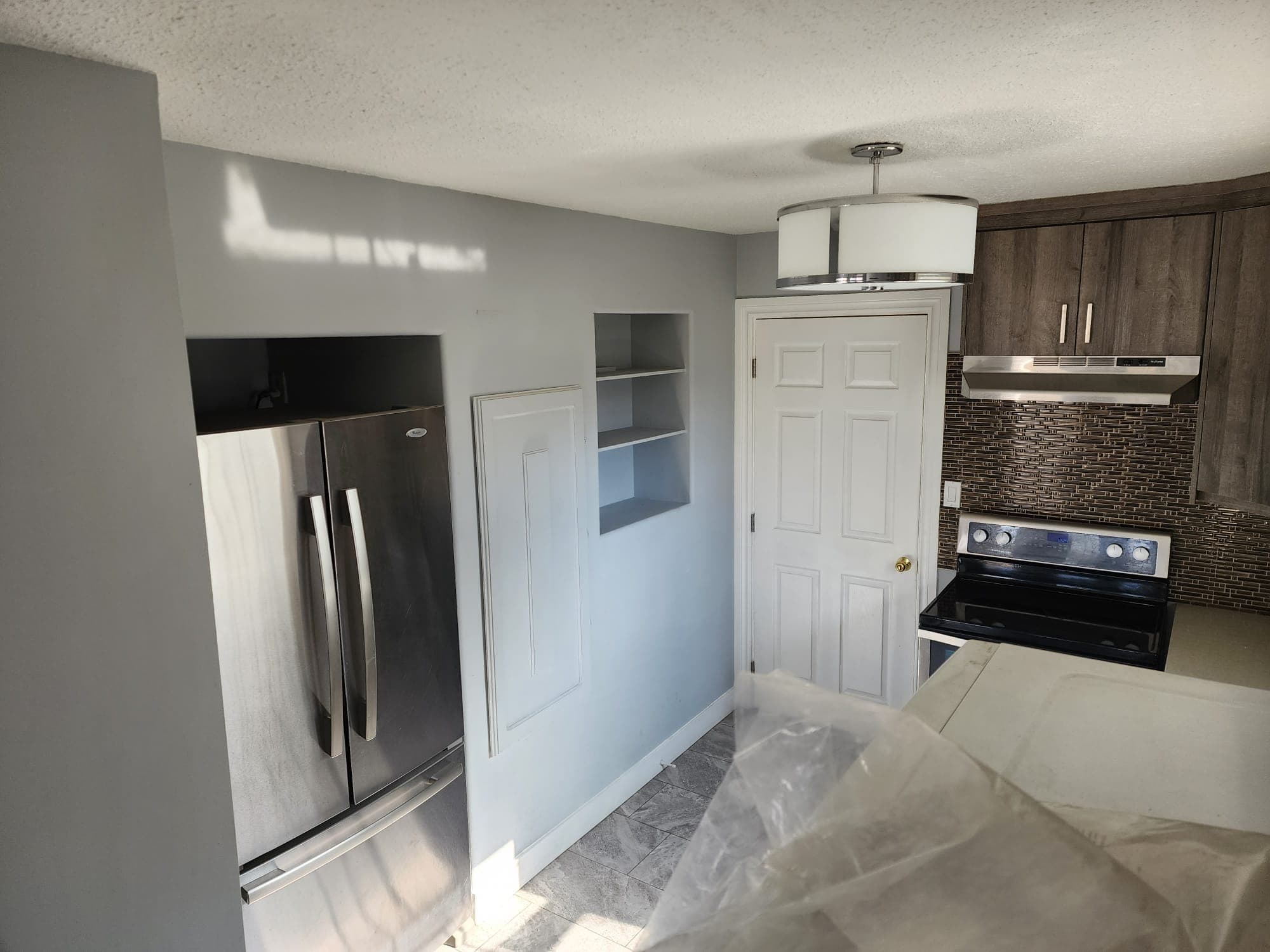 Residential renovation showcasing mudding, taping, and texturing work in Saskatoon