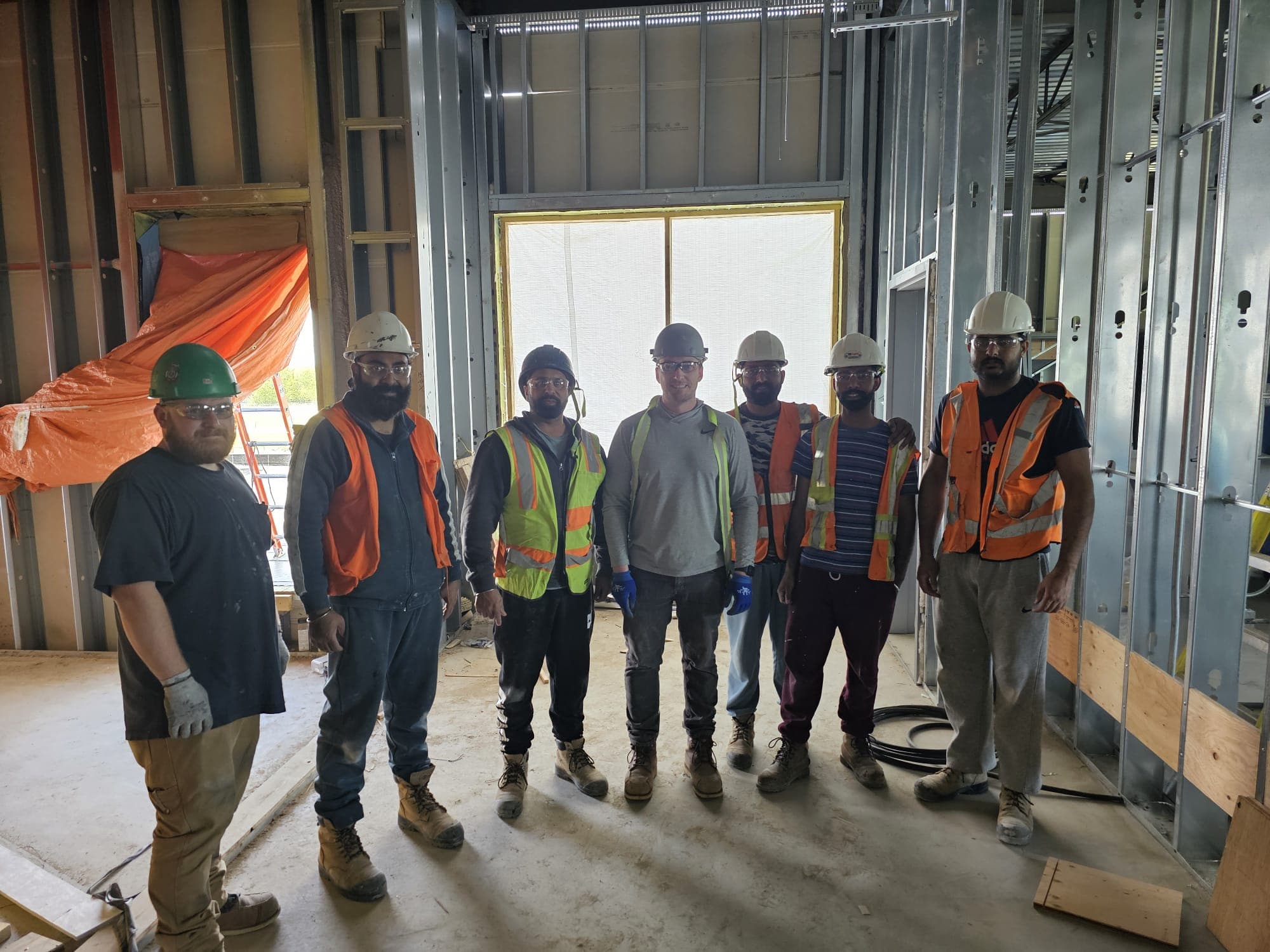 Skilled construction crew from Dil Chahal Construction working on a renovation project in Saskatoon